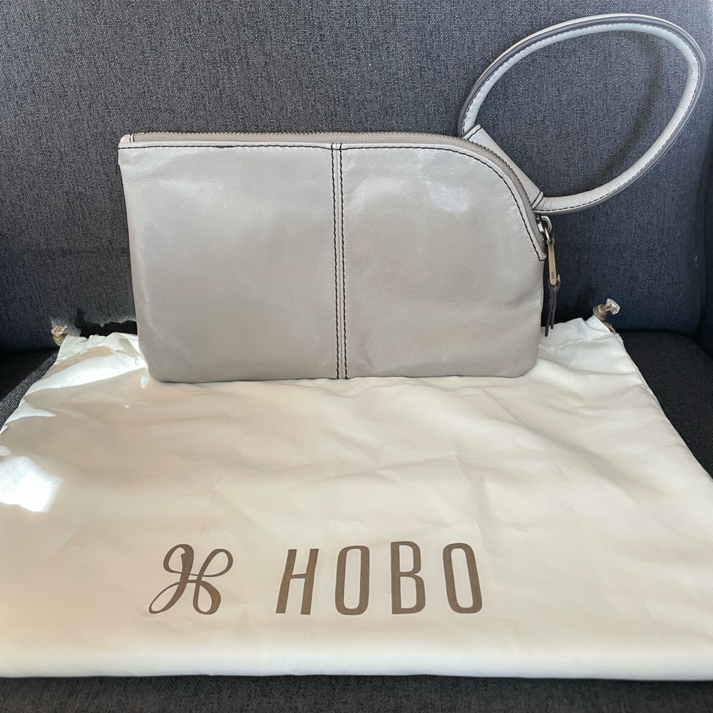 HOBO brand gray leather clutch, like new. Used one time for an event.